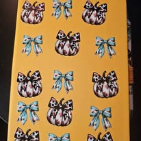 Cowhide Pumpkins with bows notebook and pen set.