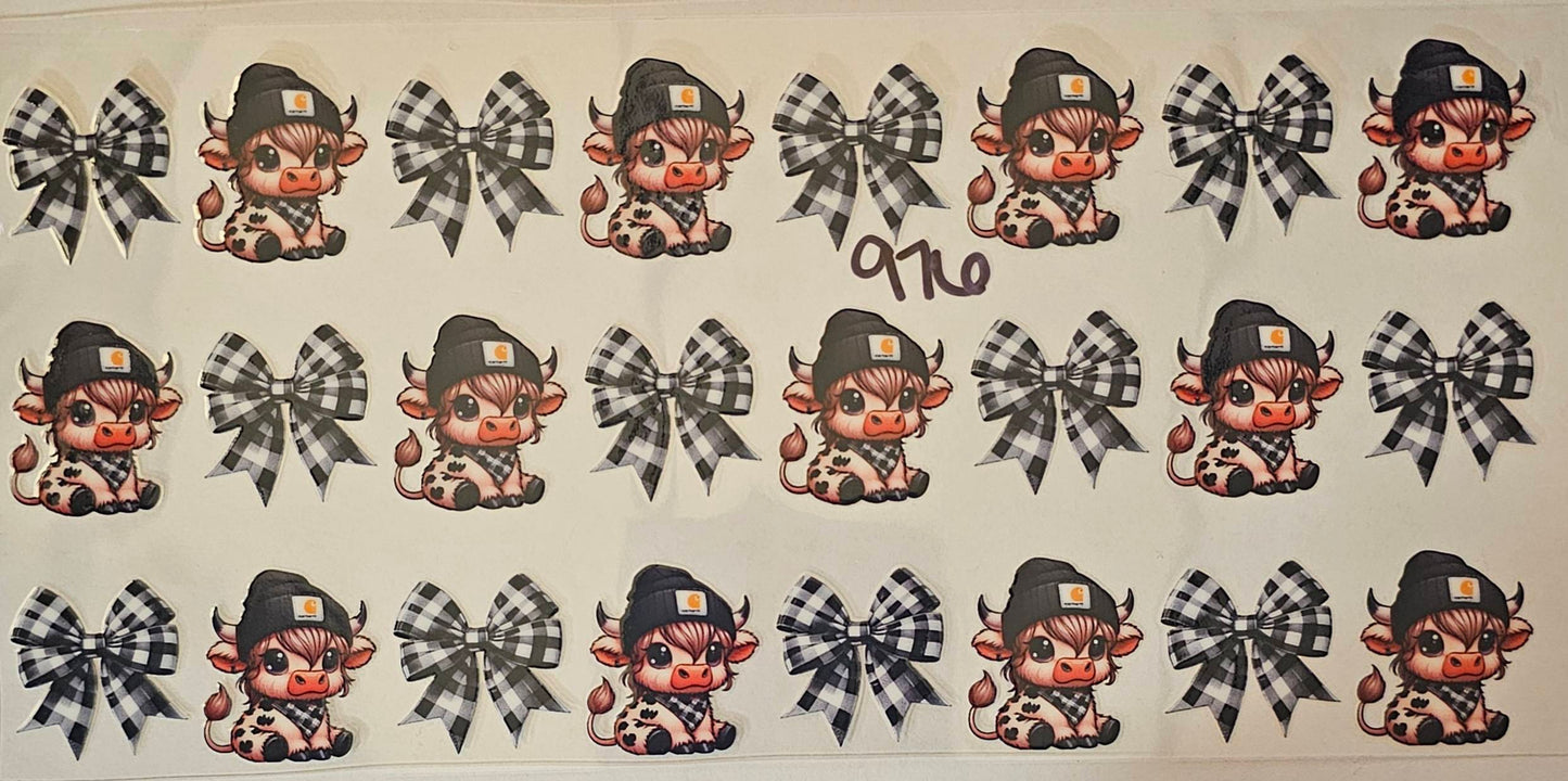 Highland cows with black beanies and plaid bows