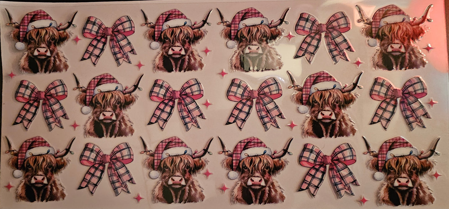 Cow with plaid Santa hat and bows.