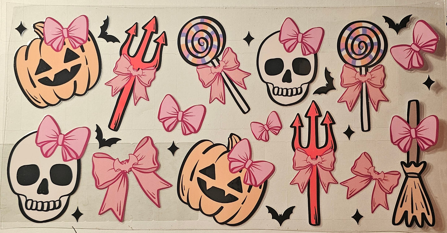 Pumpkins and skulls wearing bows