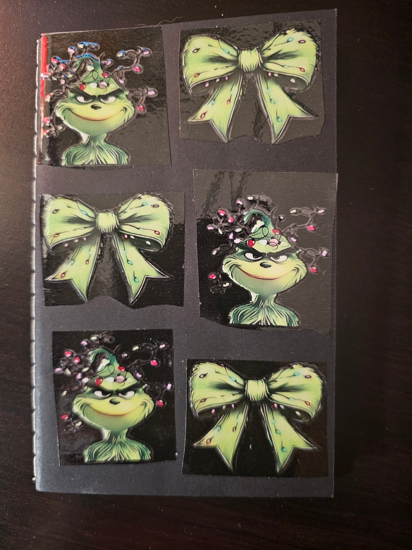 Pocket size green guy with bows and lights notebook.