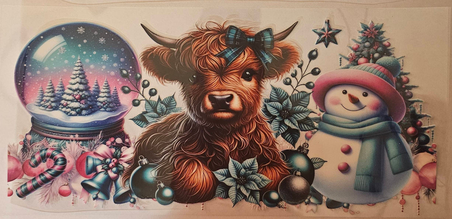 Highland cow with snowman and snow globe