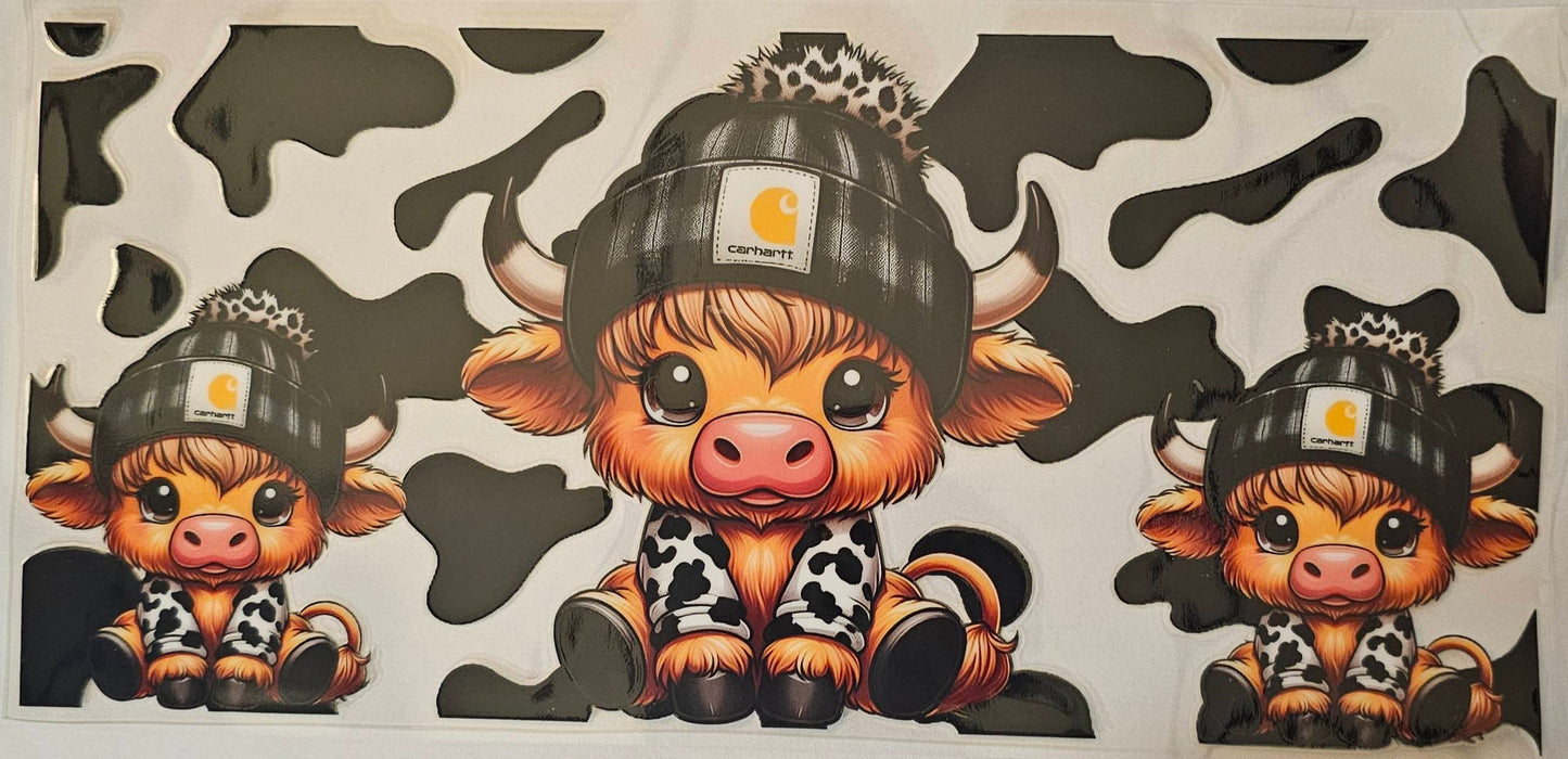 Cowhyde background with black beanie highland cow