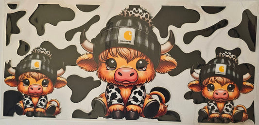 Cowhyde background with black beanie highland cow