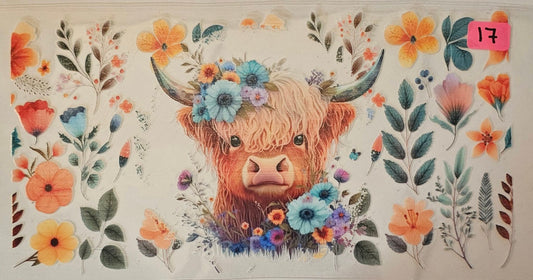 Highland cow with multicolored flowers