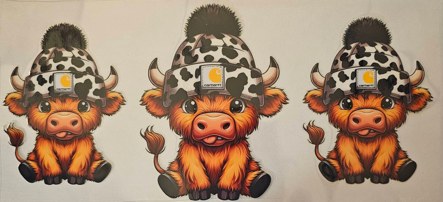 Leopard print beanie on highland cow