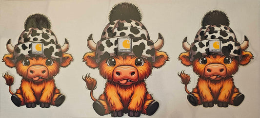 Leopard print beanie on highland cow